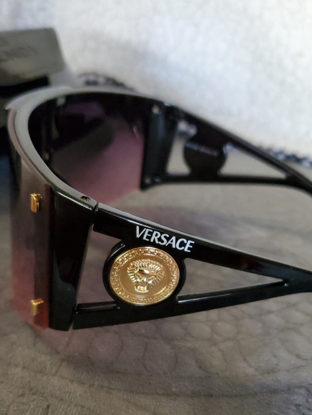 Versace Black Frame Sunglasses with Purple Gradient Lens and Gold Medallion